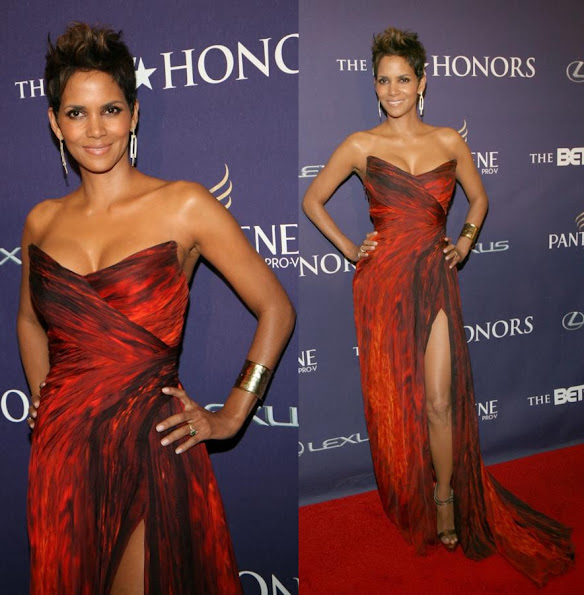 Halle Berry wore a striking Monique Lhuillier Fall 2012 gown. Brian Atwood gold Rizzo sandals, a gold cuff and drop earrings
