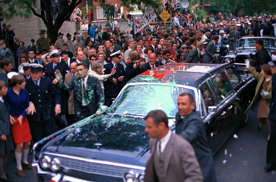 10/21/66: the refurbished JFK death car being pelted with paint during LBJ's trip to Australia