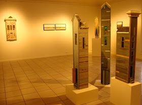 View of four of the buildings on display at the Alex Asch exhibition at Beaver Galleries.