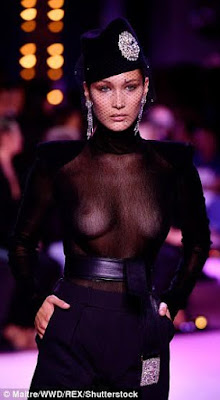 a Bella Hadid flashes her entire breasts in sheer top on Paris runway