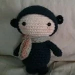 http://www.ravelry.com/patterns/library/doll-in-blue-bear-suit