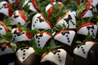Strawberries dipped in dark and white chocolate to look like shirts and jackets