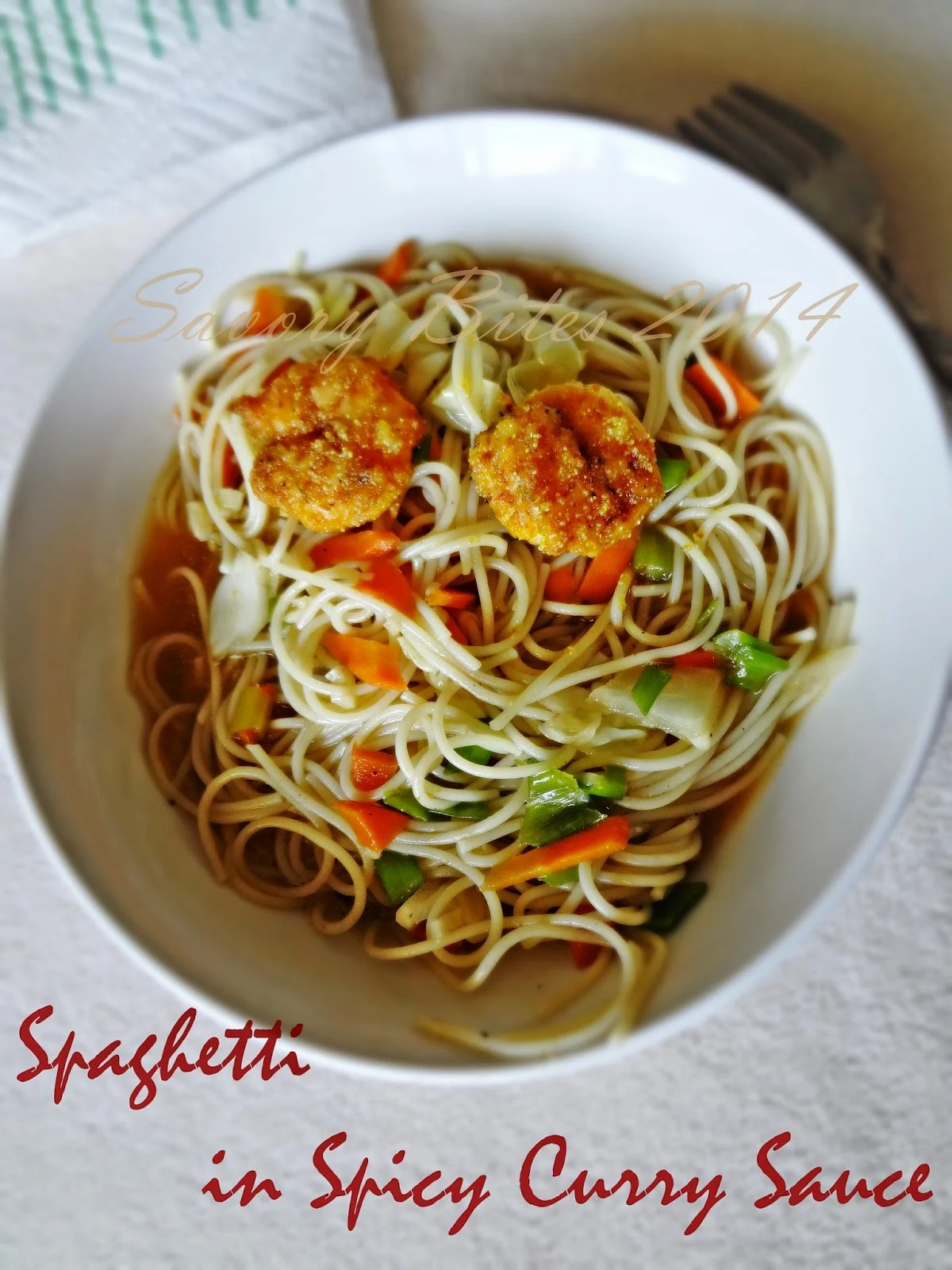 Spaghetti with spicy curry sauce with Italin spiced Prawns Fry