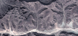 Fossilized landscape eggplant oasis on light colored stone, photo of abstract landscapes of deserts of Africa from the air, collection of Abstract Naturalism Munimara Fossilized landscape eggplant oasis on light colored stone, photo of abstract landscapes of deserts of Africa from the air