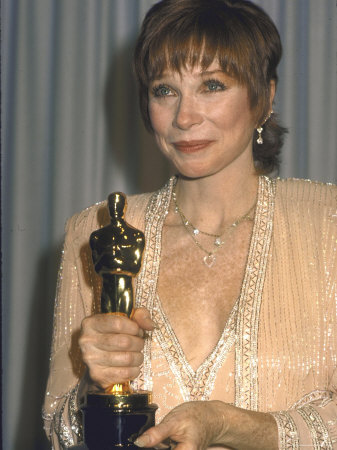 john-paschal-shirley-maclaine-holding-her-oscar-in-press-room-at-academy-awards