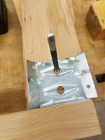 Using the bracket to mark where to drill holes