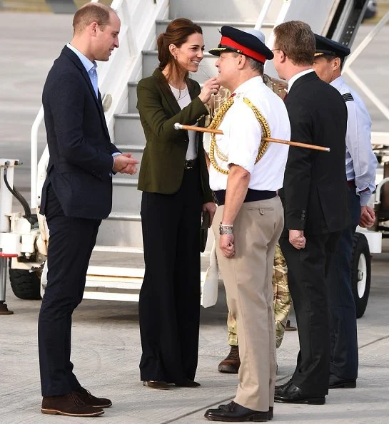 Kate Middleton's wearing her Smythe Duchess Blazer in Army green, and she carried L.K. Bennett Dora Khaki suede clutch