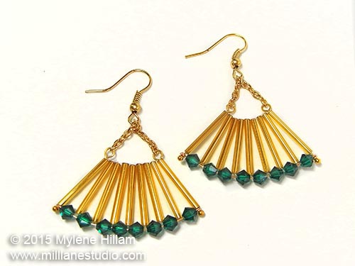 Art Deco inspired, fan-shaped earrings in Emerald and gold earrings featuring long gold bugle beads