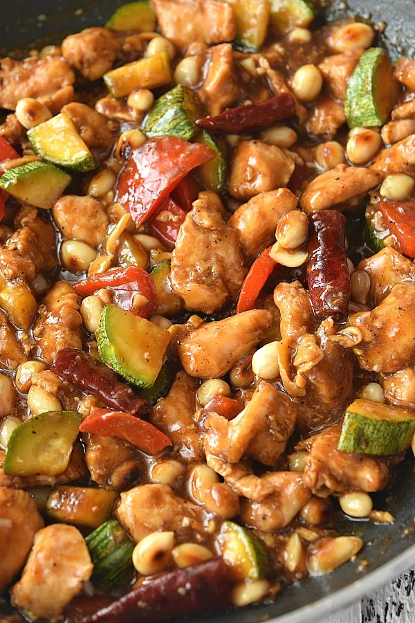 delicious kung pao chicken with bell pepper,zucchini,peanuts and chicken tossed in sauce