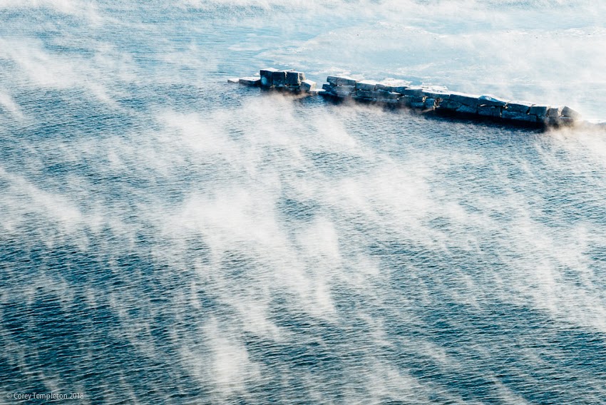 Portland, Maine USA January 2018 photo by Corey Templeton. The last trace of this morning's sea smoke from the Casco Bay Bridge. 