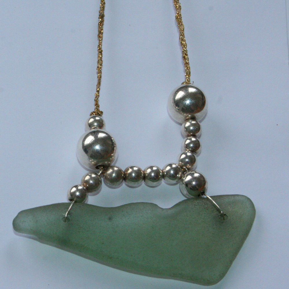 http://www.beachshackproject.bigcartel.com/product/long-deep-aqua-blue-sea-glass-necklace