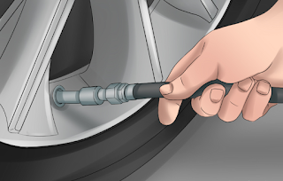 individual drawing air into tire