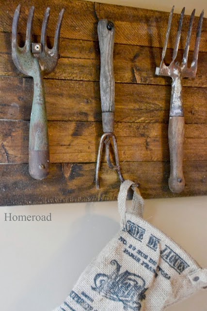 Vintage rakes attached to reclaimed wood