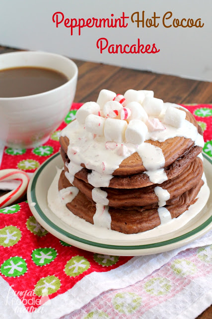 Light & fluffy pancakes are infused with lots of hot cocoa & peppermint flavor, and then topped with a super simple marshmallow cream topping in these Peppermint Hot Cocoa Pancakes.