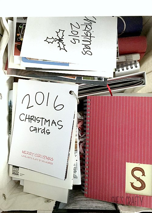 Christmas card book storage, piles of scrapbooks