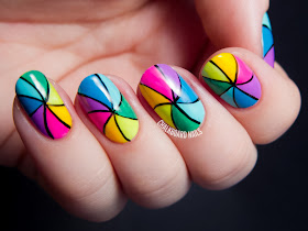 Rainbow pinwheel nail art by @chalkboardnails