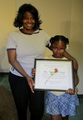 Presenting Willa McNeal with a certificate