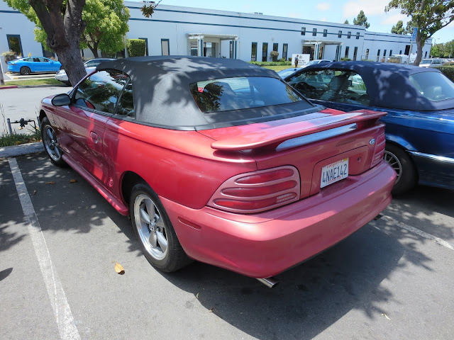 1995 Ford Mustang with faded paint before refinishing at Almost Everything Auto Body