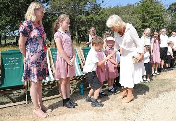 The Duchess of Cornwall was welcomed by Dame Judi Dench – the patron of the Friends of Osborne and curator of Osborne House, Michael Hunter