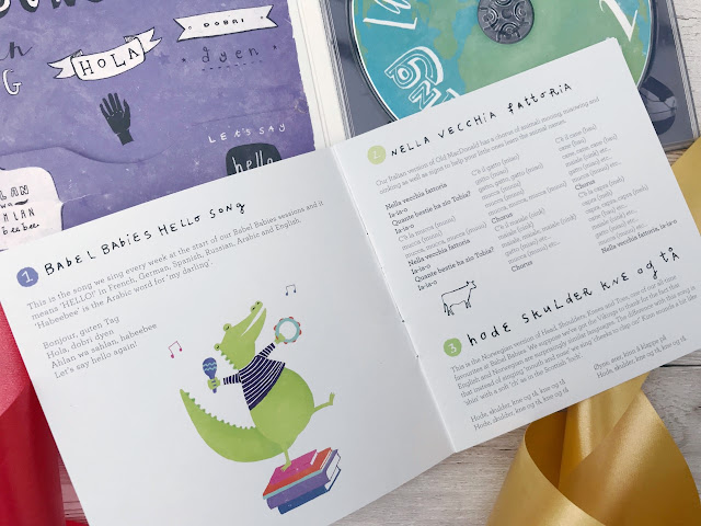Flat lay showing the open CD case and booklet showing the song words