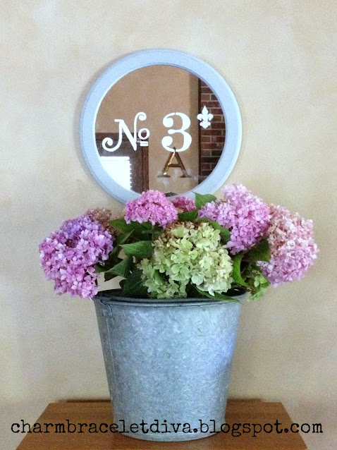 painted round French mirror with etched number 3