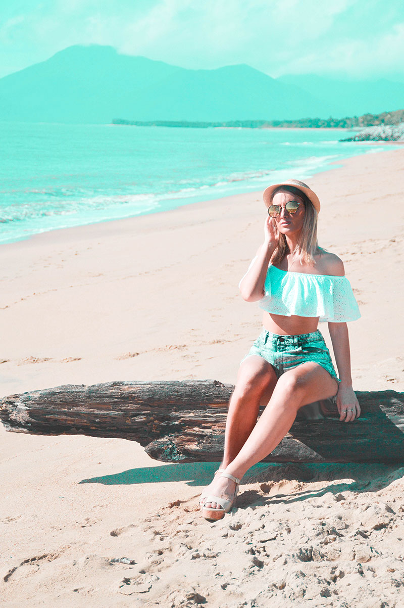 summer beach outfit off shoulder white top denim shorts wedge heels and hat on far north queensland cairns beach summer beach outfit off shoulder white top denim shorts wedge heels and hat on far north queensland cairns beach