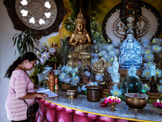 In The Room Of Buddhist Shrine Traveler A Woman Reading A Book At Buddhist Monastery North Bali Indonesia