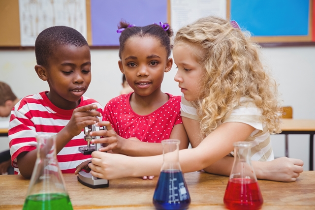 namc montessori lower elementary chemistry children with microscope