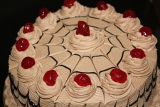 cake white frosting cherries on top Metamora Herald cake white frosting