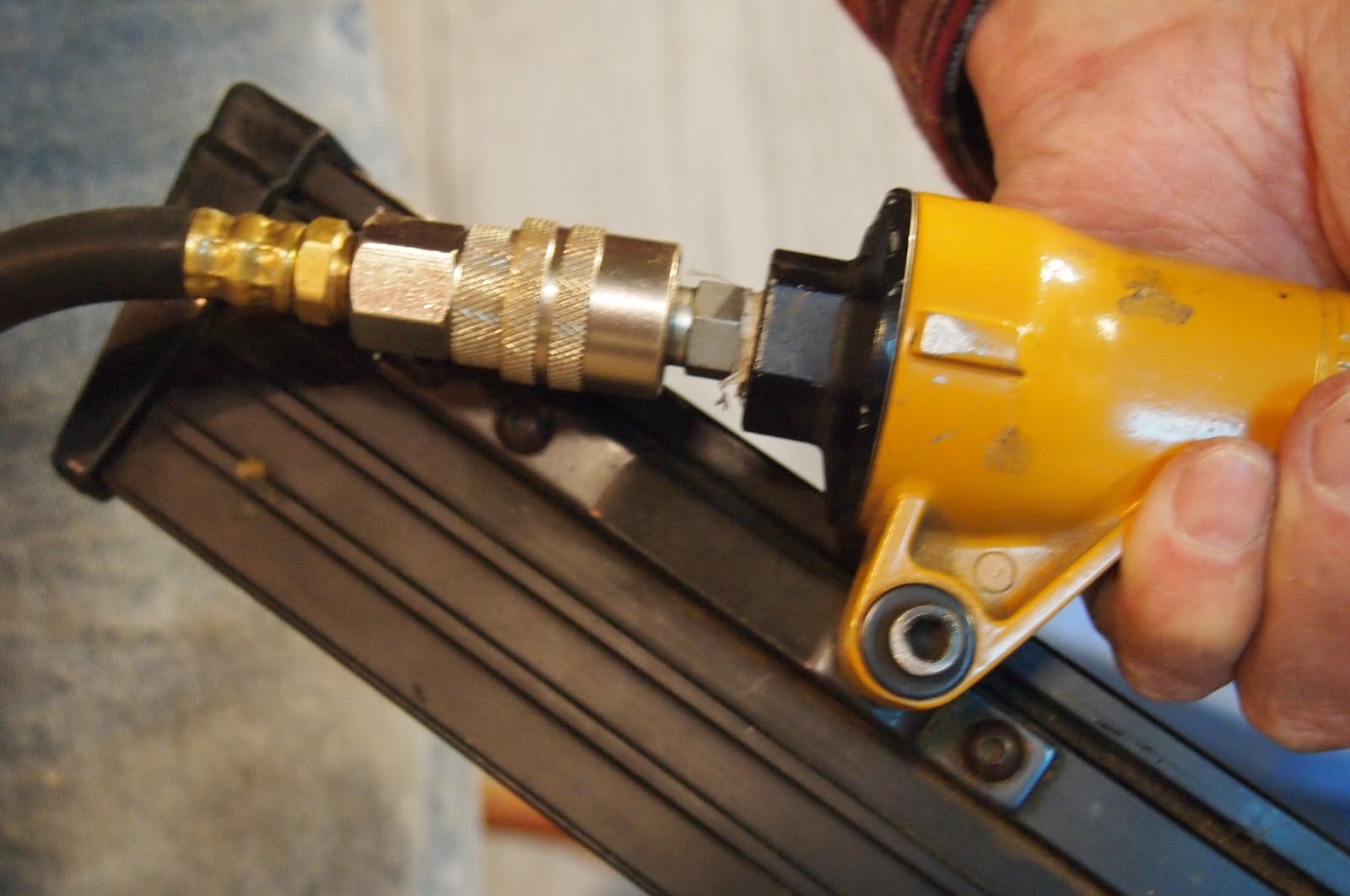 How to Build a Canvas Stretcher 19. Attach hose to nail gun