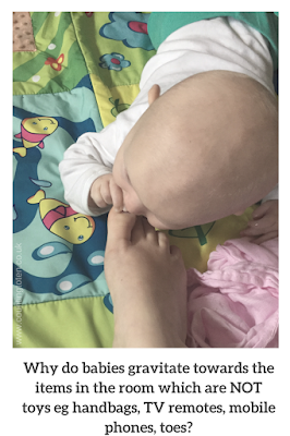 Photograph of a baby eating a big toe