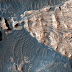 Uplifted Blocks of Light-Toned Layered Deposits in Mars