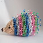 http://www.ravelry.com/patterns/library/striped-hedgehog-pin-cushion