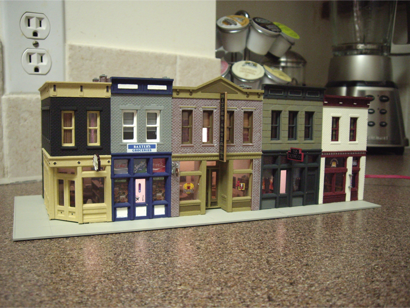 Front of a completed Walthers Merchant’s Row I kit displayed on a kitchen counter