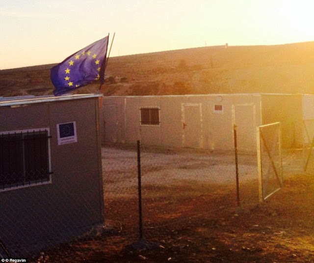  British MPs slam "illegal EU settlements" built in Area C with their tax dollars EU_flag_flies_above_an_unauthorised_building_erected_-a-11_1457449957578
