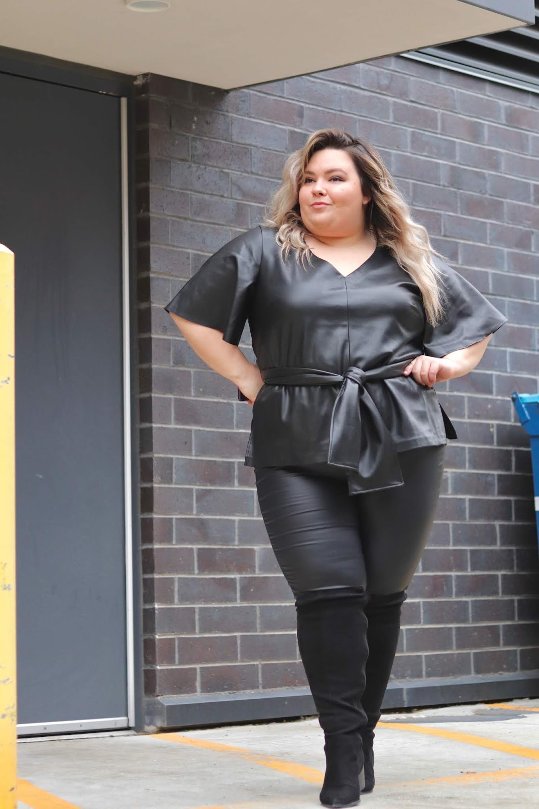 Chicago Plus Size Petite Fashion Blogger Natalie in the City reviews Eloquii's faux leather outfit.