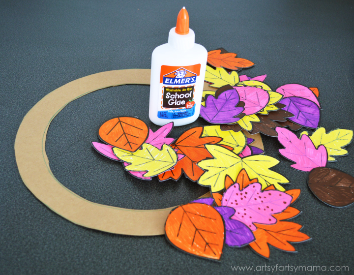 Kids DIY Autumn Leaf Wreath at artsyfartsymama.com #fall #kidscraft #Elmers
