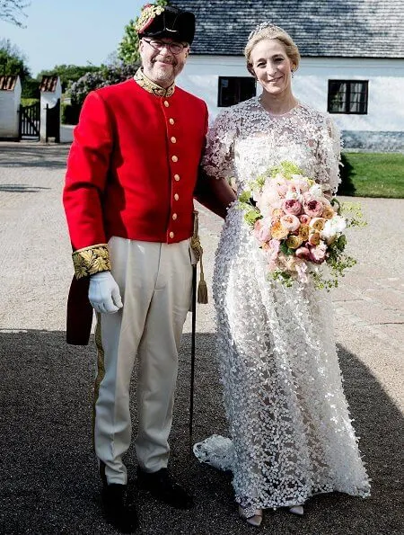 Princess Alexandra is wearing the Ahlefeldt-Laurvig-Bille floral tiara, wedding lace dress. Princess Nathalie and Princess Sumaya