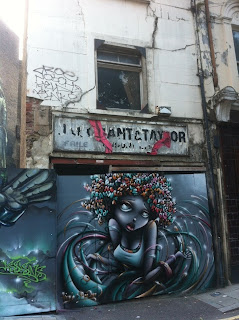 Ghost sign on abandoned building, Gun Street, London E1