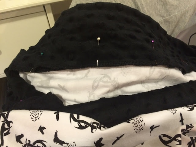 Folding minky over, pinning, and sewing a straight stitch to finish the pillowcase. Folding minky over, pinning, and sewing a straight stitch to finish the pillowcase.