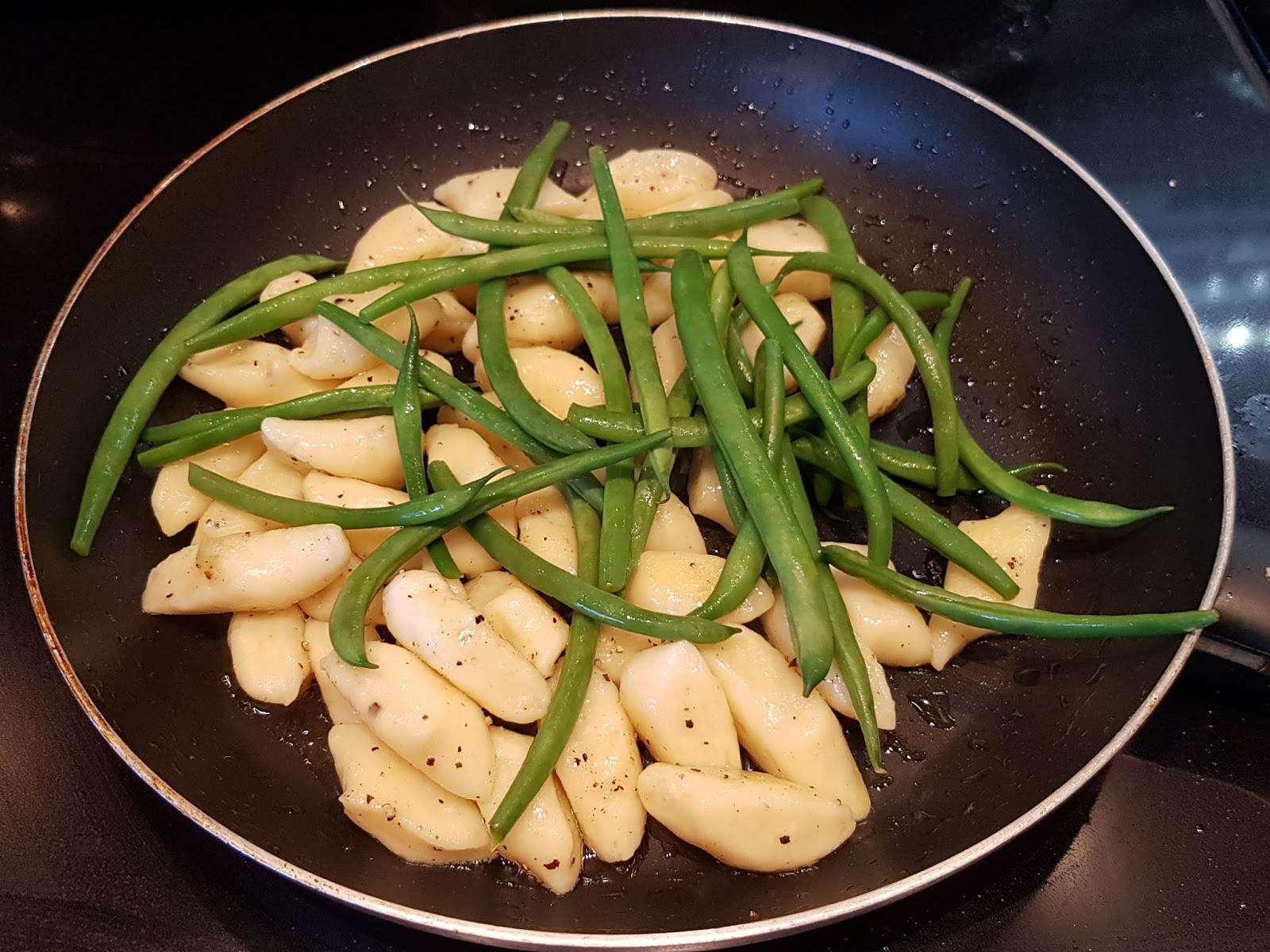 Almost Wasted Baked Cod with Crispy Gnocchi, Green Beans, Grape