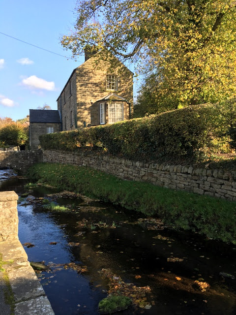 Wrapping Up England: our accommodation in Beeley, Derbyshire, England stream with stone walls, and a small stone house