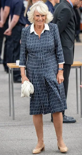 The Duchess visited South Western Ambulance Service. pearl earrings blue print collar midi dress, pearl necklace, beige pumps