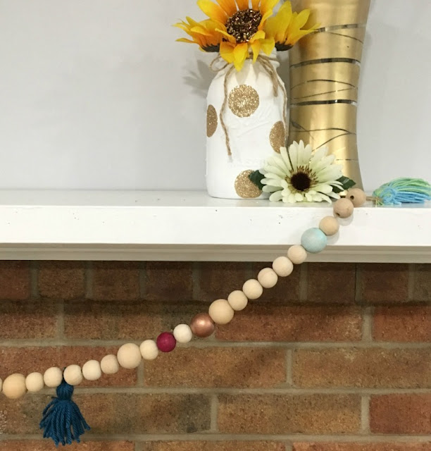 Make a colorful wooden bead garland that you could use as a necklace or home decor!