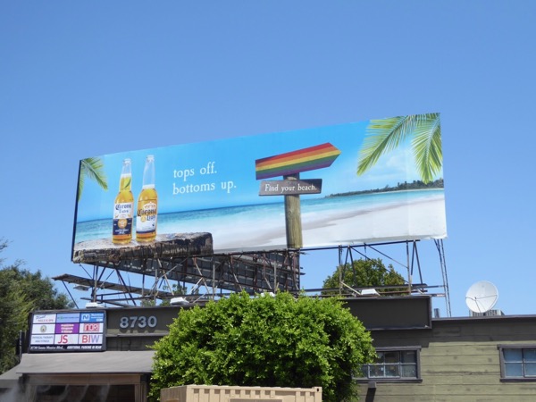 Tops off Bottoms up Corona LGBT rainbow sign billboard Bottoms up Corona LGBT rainbow billboard