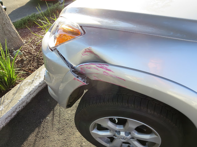 Dented fender and scraped bumper on 2012 Rav4 before auto body repairs at Almost Everything Auto Body