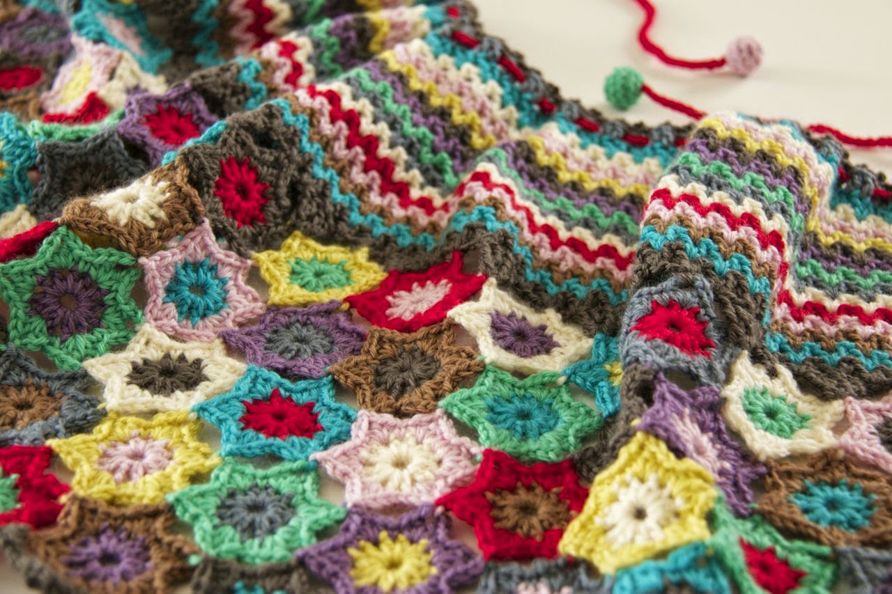 Close up detail shot of stars and v-stitch neckline Close up detail shot of stars and v-stitch neckline