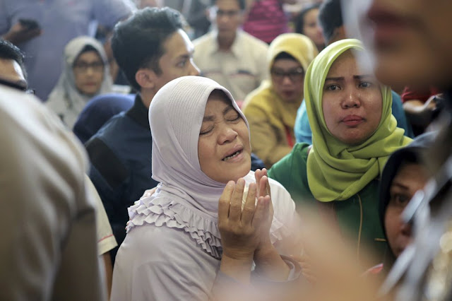 Photos: Relatives of Lion Air Crash victims mourn at airport; Authorities say likely no survivors