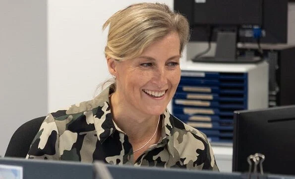 During her visit, the Countess of Wessex wore a camouflage shirt dress by French Connection