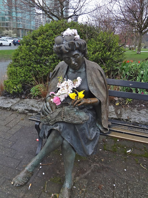 statue with flowers in vancouver